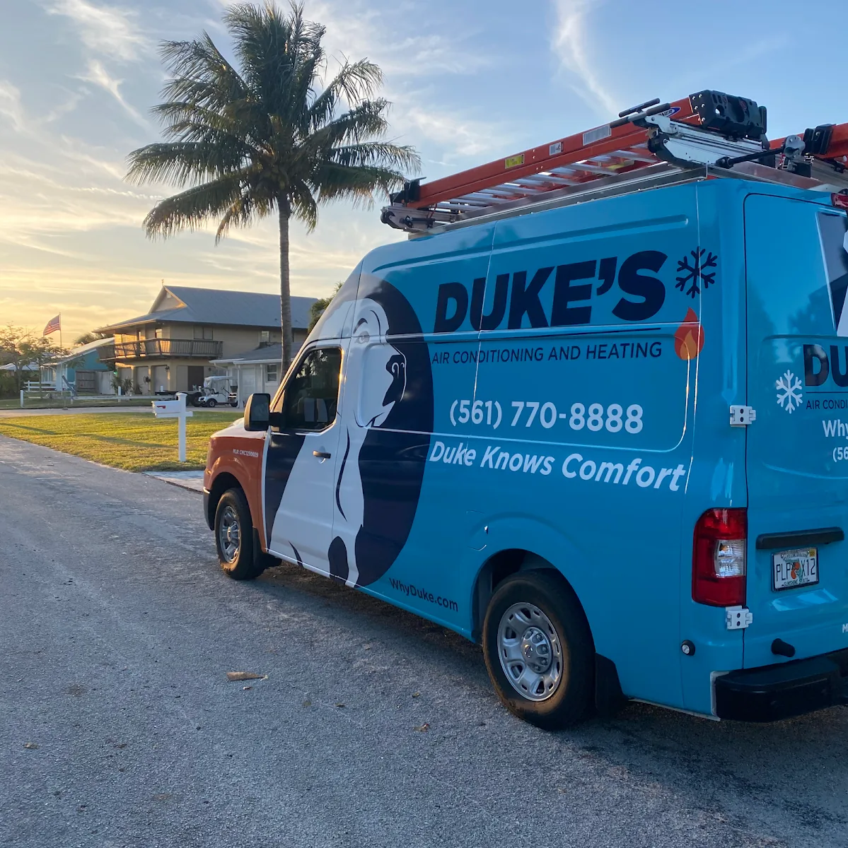Duke's Air Conditioning and Heating service van parked on a Jupiter street at sunset